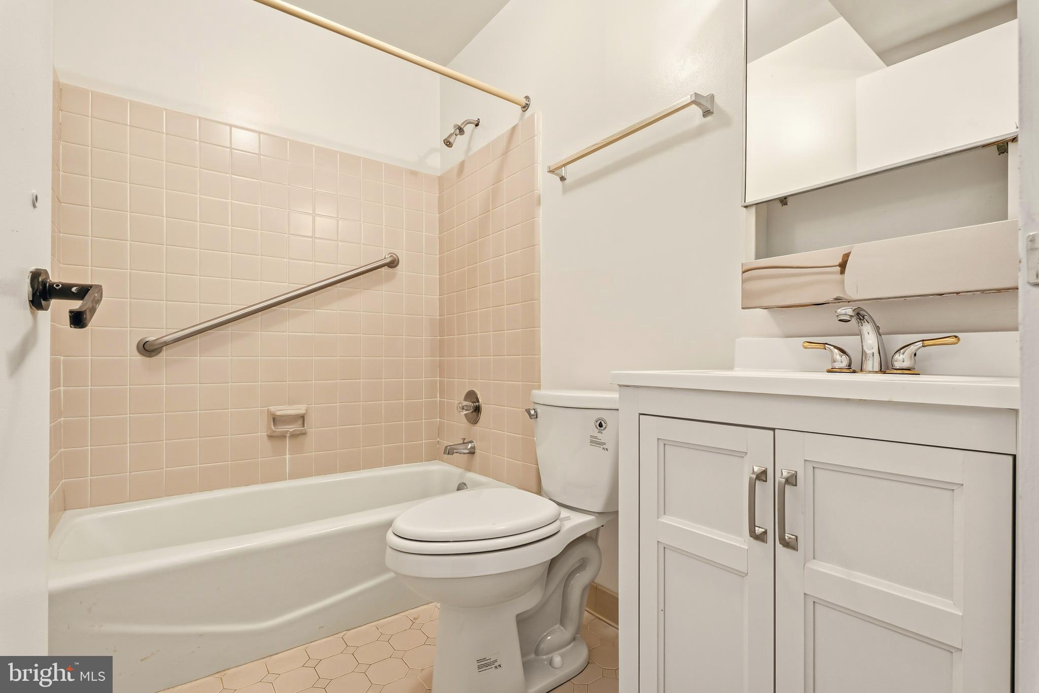 2 Riderwood Station Towson, MD 21204 - Photo 51 of 58 a bathroom with a sink a toilet and shower