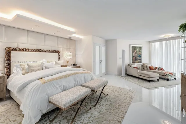 a bedroom with a bed and a chair