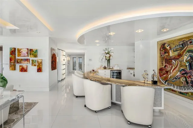 a large room with lots of counter space and painting on the wall