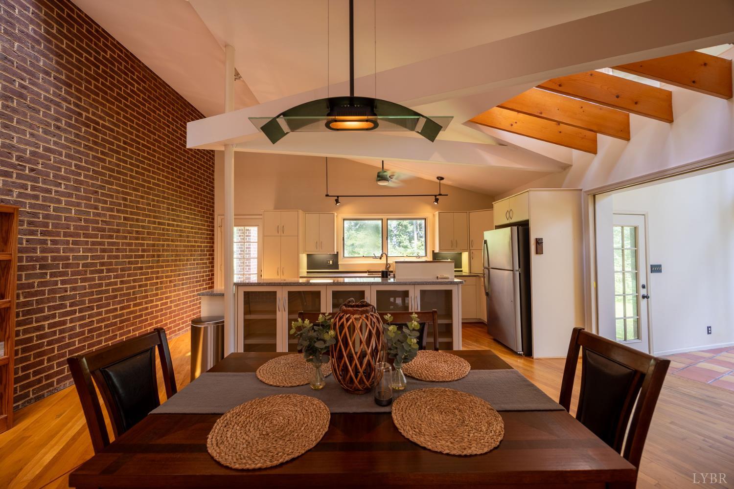 2246 Country Club Road Appomattox, VA 24522 - Photo 12 of 41 a view of a dining room with furniture window and wooden floor