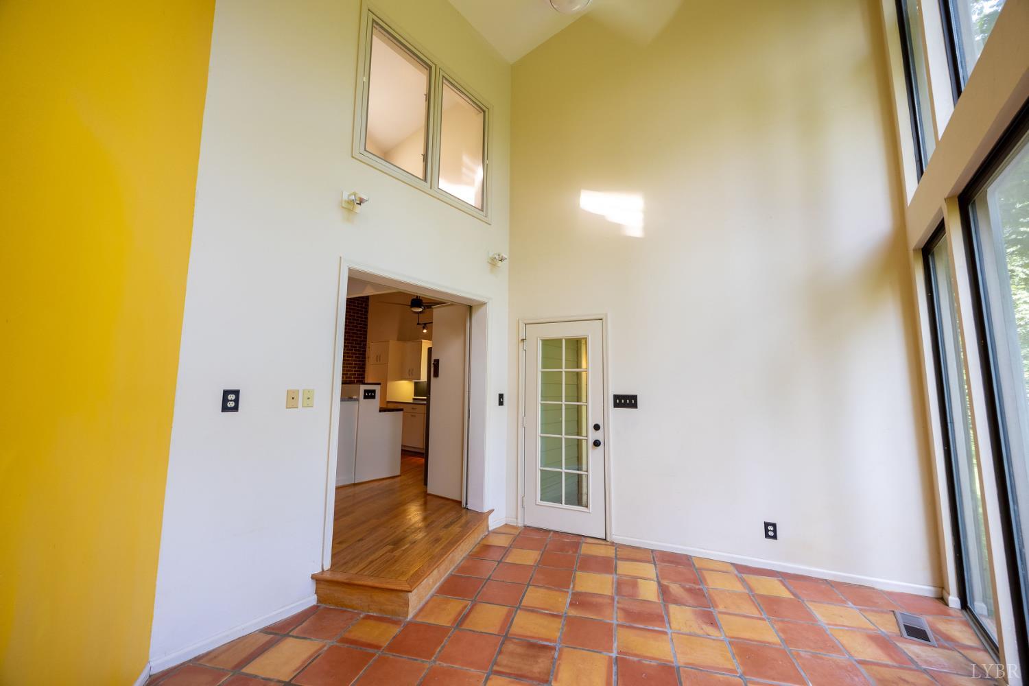 2246 Country Club Road Appomattox, VA 24522 - Photo 15 of 41 a view of a hallway with wooden floor and a bathroom