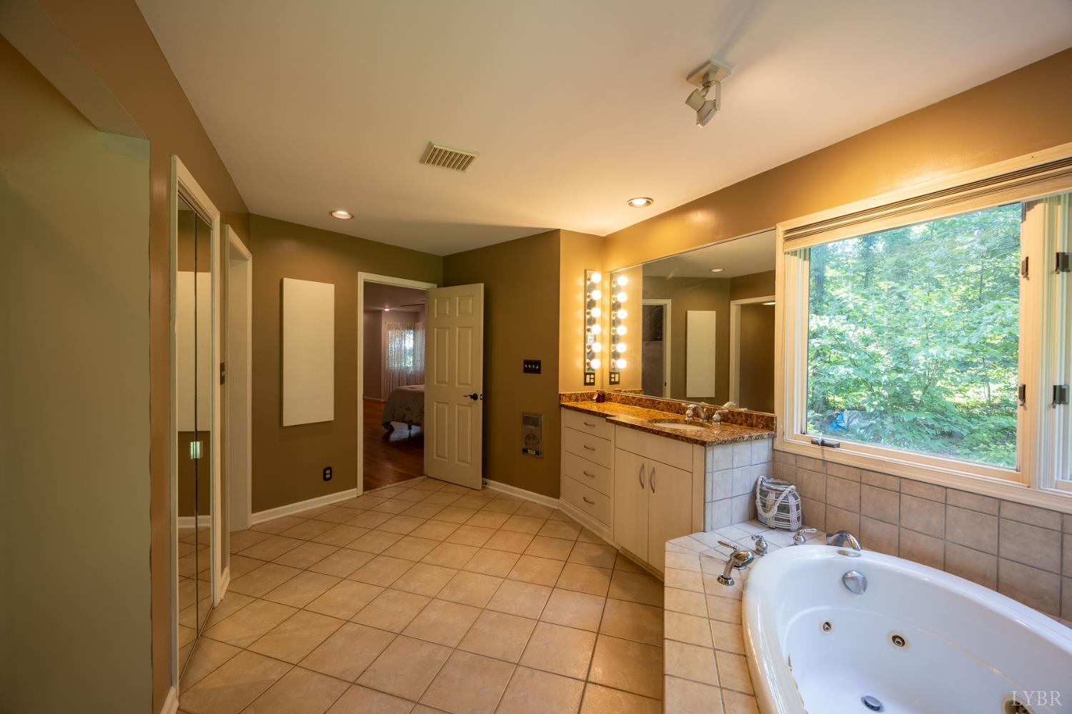 2246 Country Club Road Appomattox, VA 24522 - Photo 25 of 41 a large bathroom with a large tub shower and sink