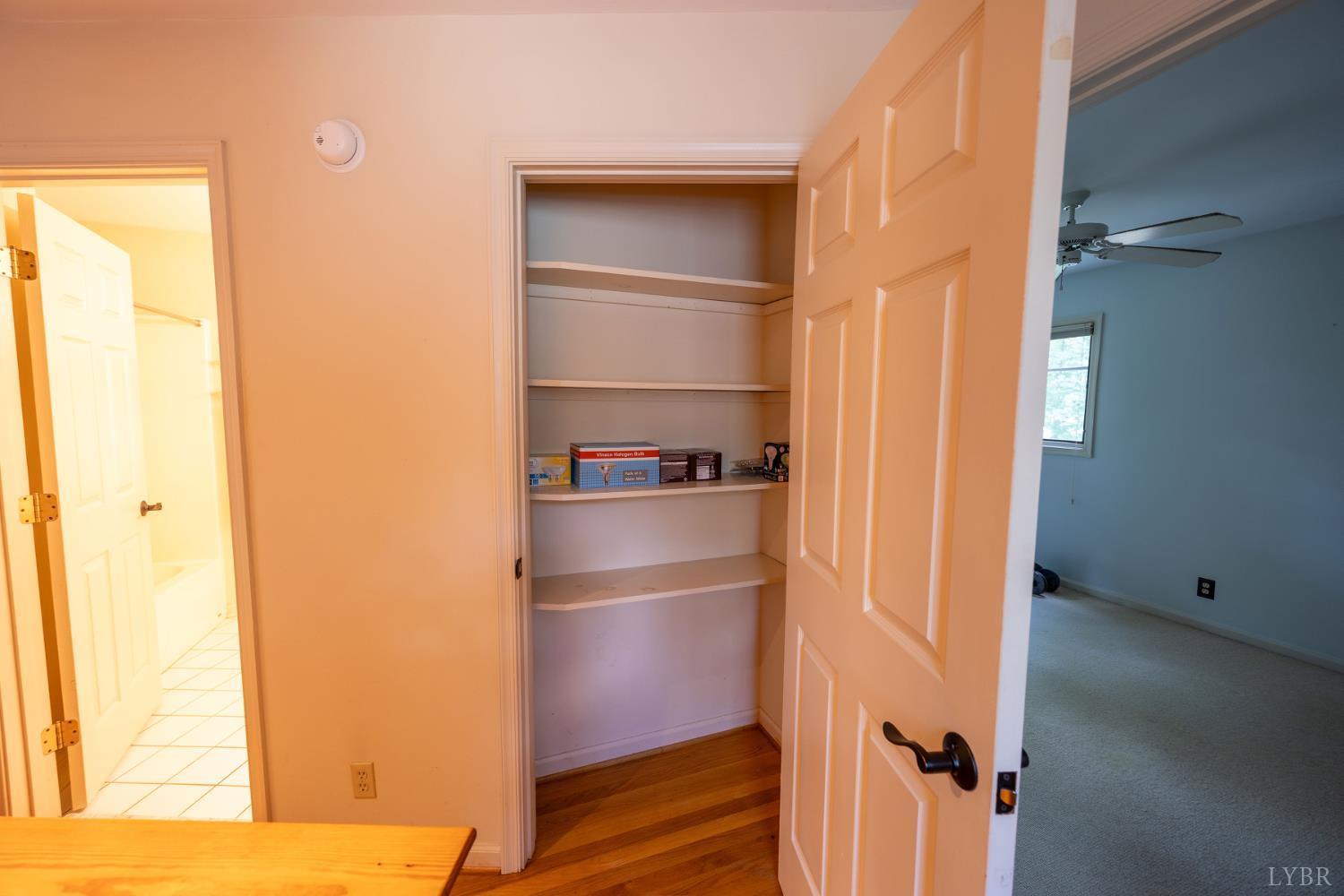 2246 Country Club Road Appomattox, VA 24522 - Photo 30 of 41 a view of walk in closet with empty racks