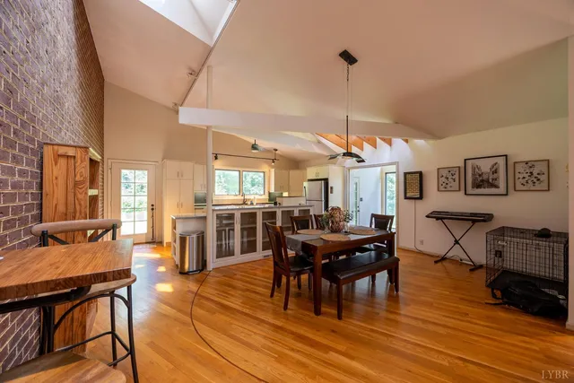 a view of a brick wall with chair and table in the room