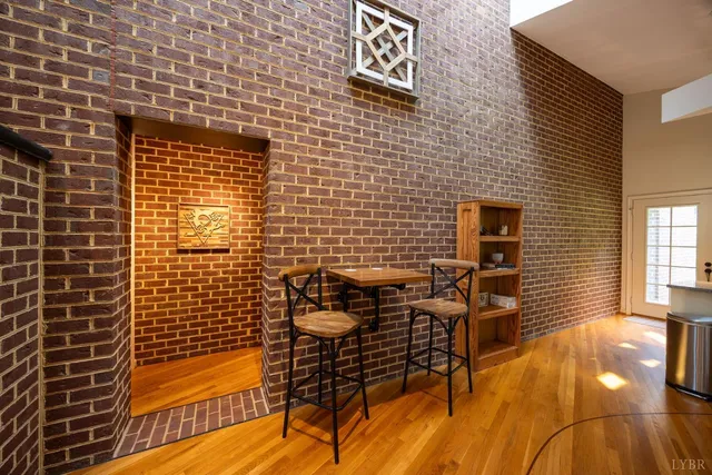 a view of a livingroom with furniture and a fireplace