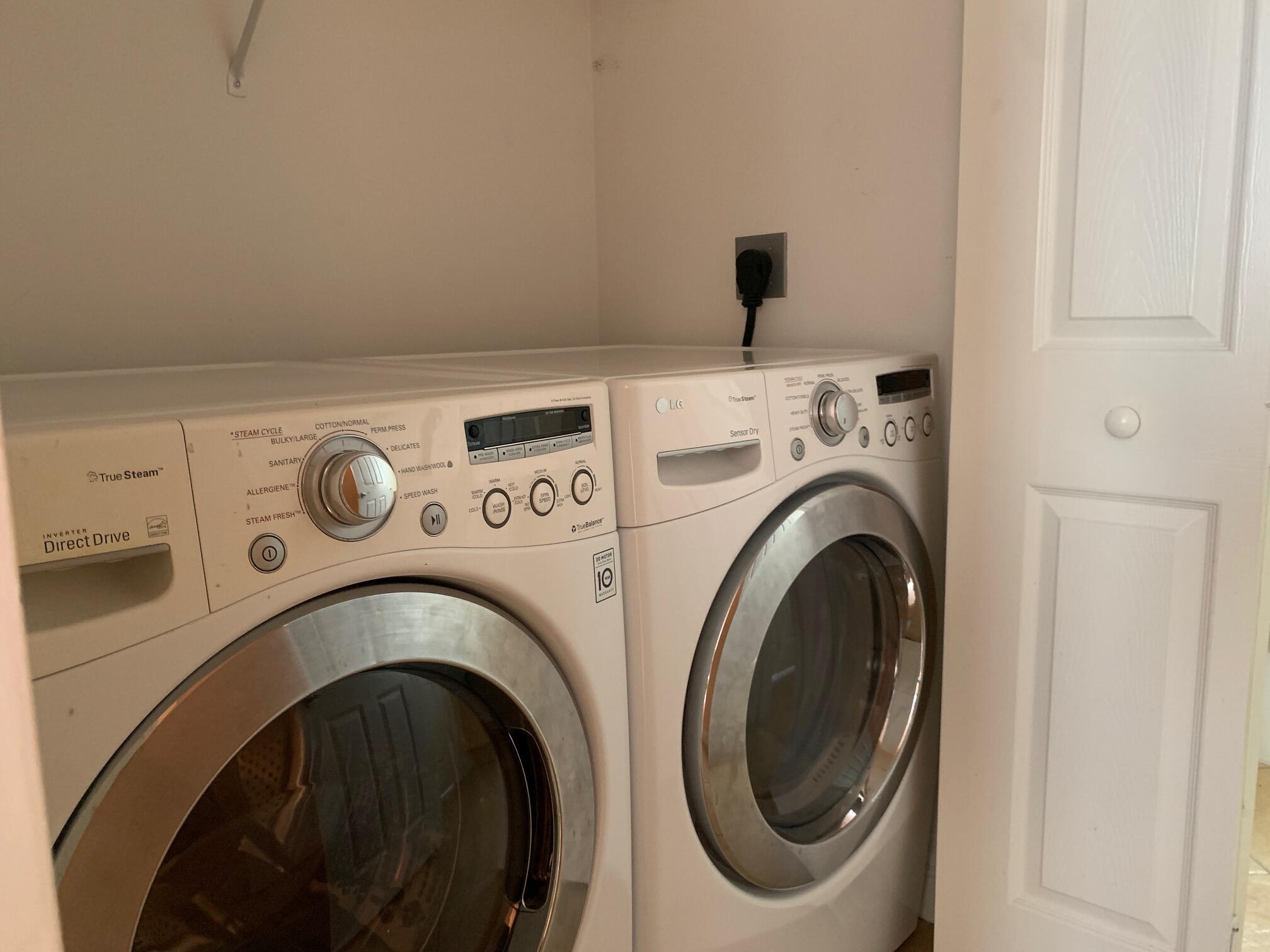 145 Morning Dew Circle Jupiter, FL 33458 - Photo 12 of 12 a utility room with dryer and washer
