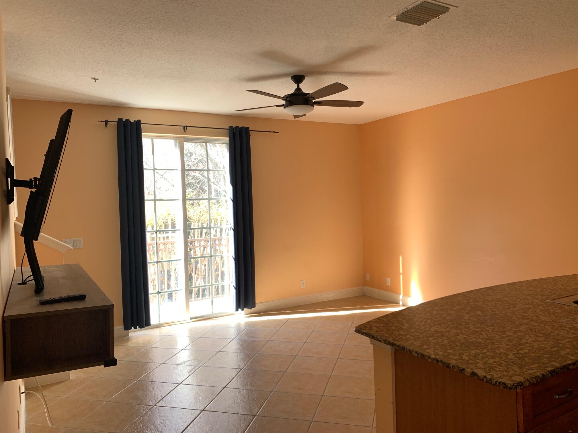 145 Morning Dew Circle Jupiter, FL 33458 - Photo 4 of 12 a view of a kitchen with a sink and a window