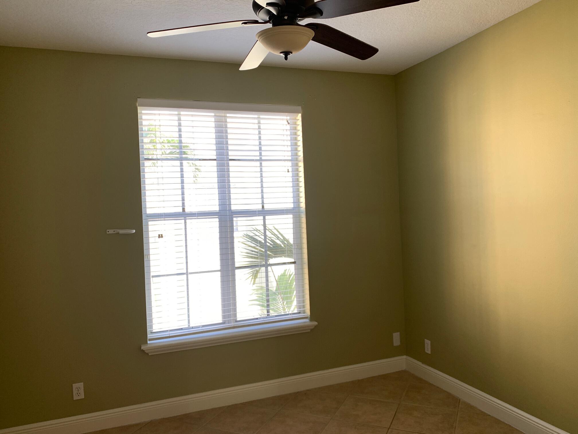 145 Morning Dew Circle Jupiter, FL 33458 - Photo 7 of 12 an empty room with a window