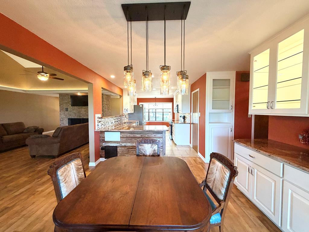 707 Rimrock Road Kerrville, TX 78028 - Photo 21 of 55 a living room with furniture large window and wooden floor