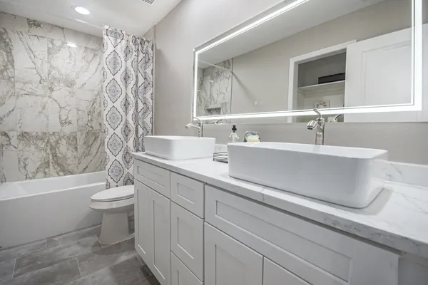 a bathroom with a sink a toilet and a bathtub