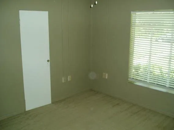 a kitchen with stainless steel appliances white cabinets and a sink