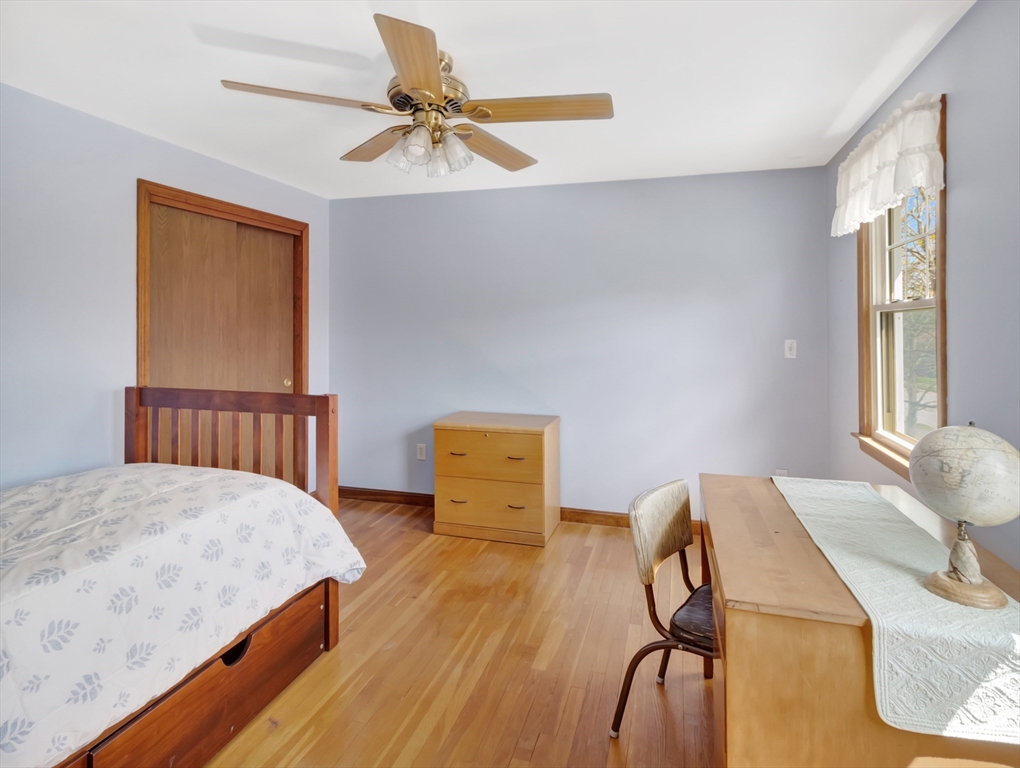 15 Riverside Drive Mansfield, MA 02048 - Photo 24 of 42 a bedroom with a bed and a table in it