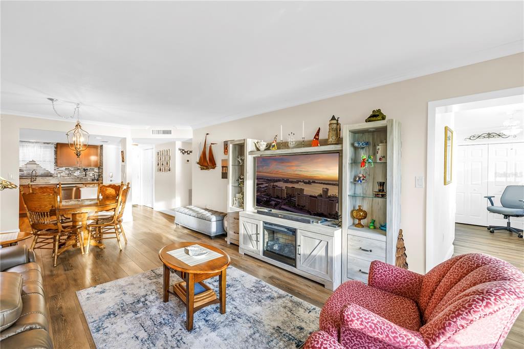 4525 Cove Circle, Unit 102 St. Petersburg, FL 33708 - Photo 22 of 73 a living room with furniture and a flat screen tv