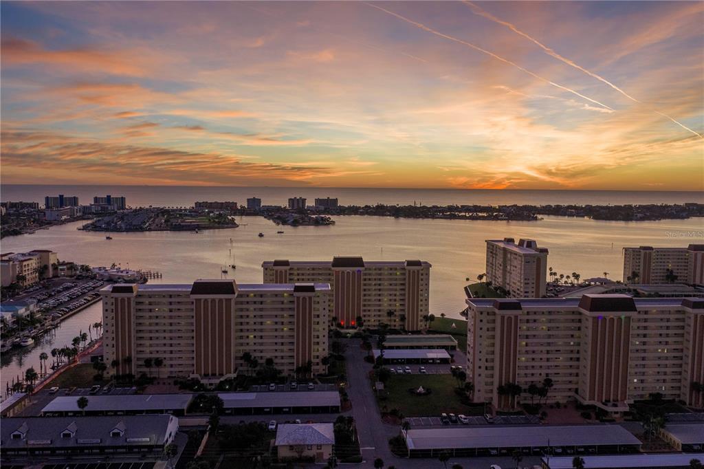 4525 Cove Circle, Unit 102 St. Petersburg, FL 33708 - Photo 34 of 73 a view of a lake with tall buildings