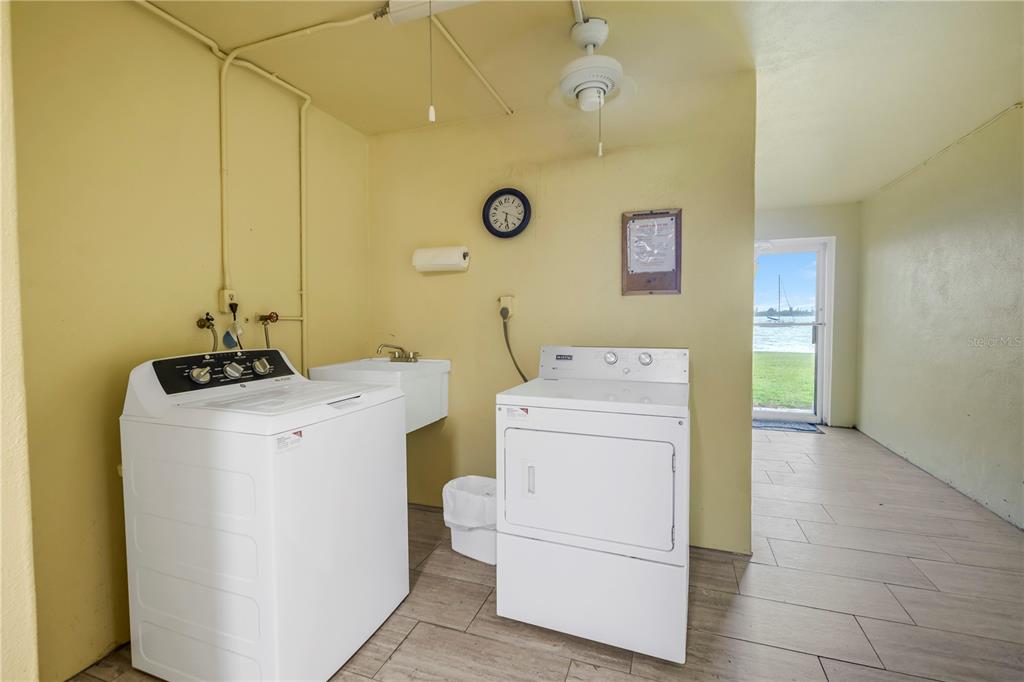 4525 Cove Circle, Unit 102 St. Petersburg, FL 33708 - Photo 45 of 73 a utility room with dryer and washer
