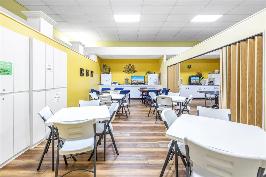 4525 Cove Circle, Unit 102 St. Petersburg, FL 33708 - Photo 58 of 73 a view of a dining room with furniture window and outside view