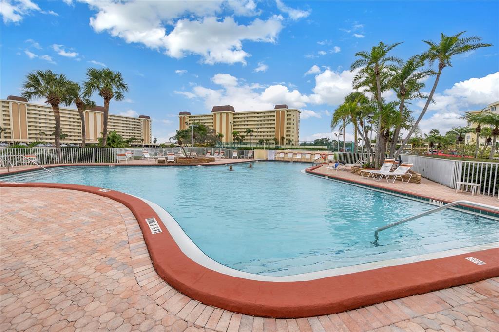 4525 Cove Circle, Unit 102 St. Petersburg, FL 33708 - Photo 64 of 73 a view of a swimming pool with a terrace