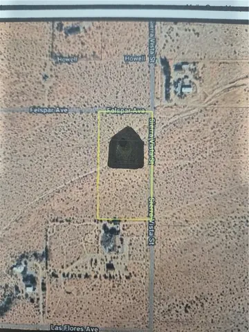 a brick wall with a shower and a sink