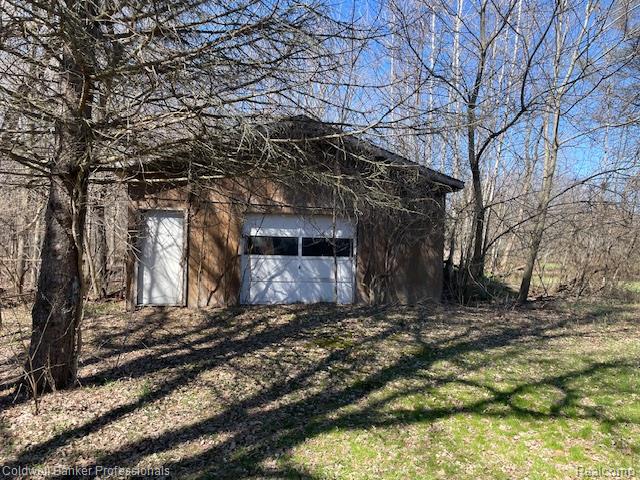 5447 Rensselear Drive Lapeer, MI 48446 - Photo 18 of 22 Outbuilding 2 with dirt floor, electricity. Lots of opportunity to make this your own