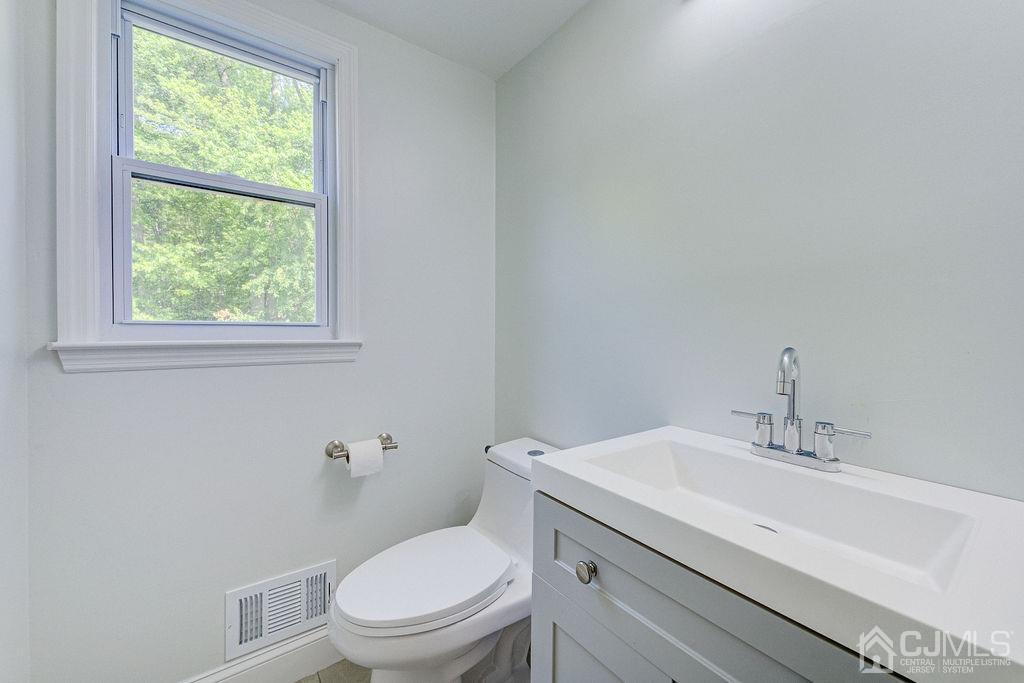 16 Oak Tree Road Monmouth Junction, NJ 08852 - Photo 15 of 29 a bathroom with a sink a toilet and window