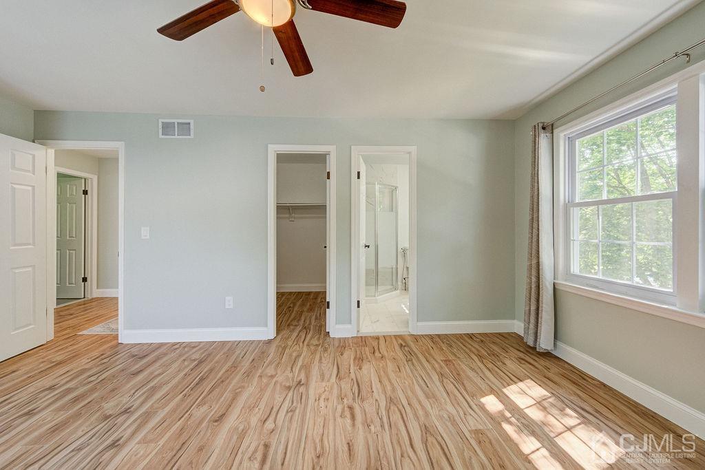16 Oak Tree Road Monmouth Junction, NJ 08852 - Photo 16 of 29 a view of empty room with wooden floor and window