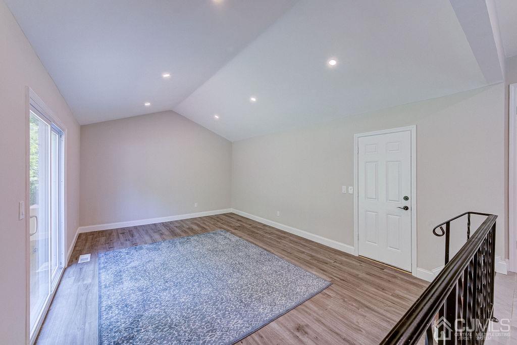 16 Oak Tree Road Monmouth Junction, NJ 08852 - Photo 19 of 29 wooden floor in an empty room with a carpet