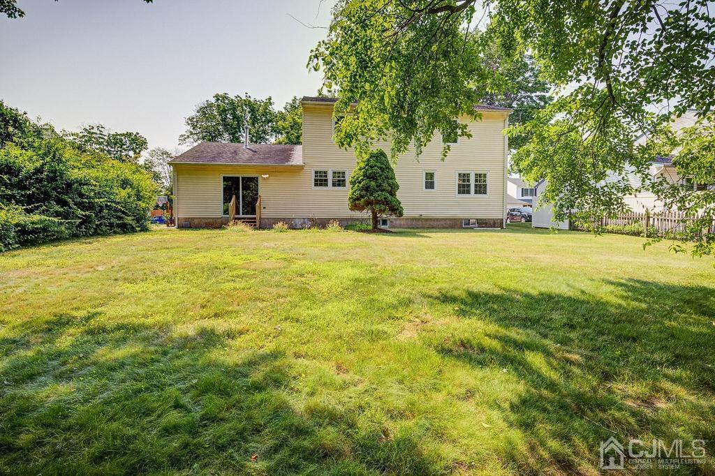 16 Oak Tree Road Monmouth Junction, NJ 08852 - Photo 27 of 29 a front view of house with yard and trees