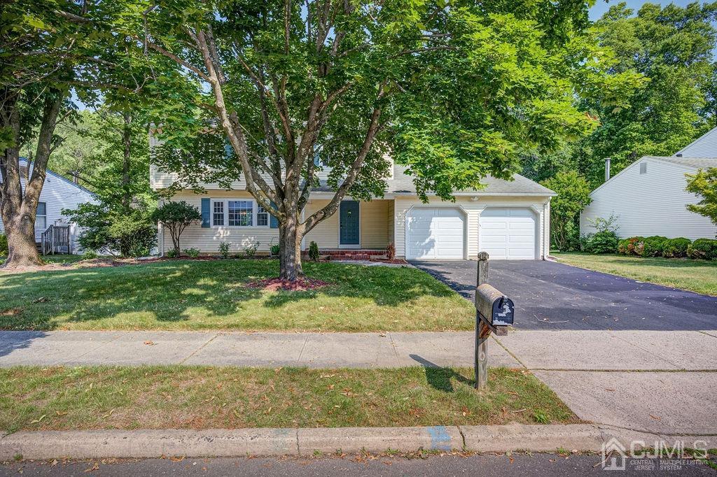 16 Oak Tree Road Monmouth Junction, NJ 08852 - Photo 28 of 29 a front view of house with yard and green space