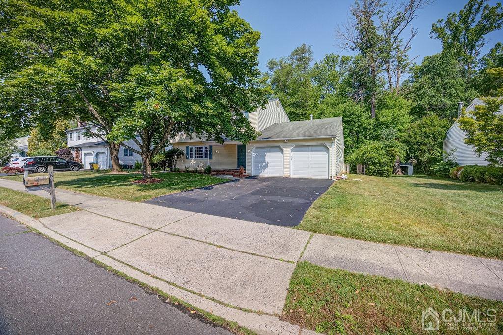 16 Oak Tree Road Monmouth Junction, NJ 08852 - Photo 29 of 29 a front view of a house with a yard and garage