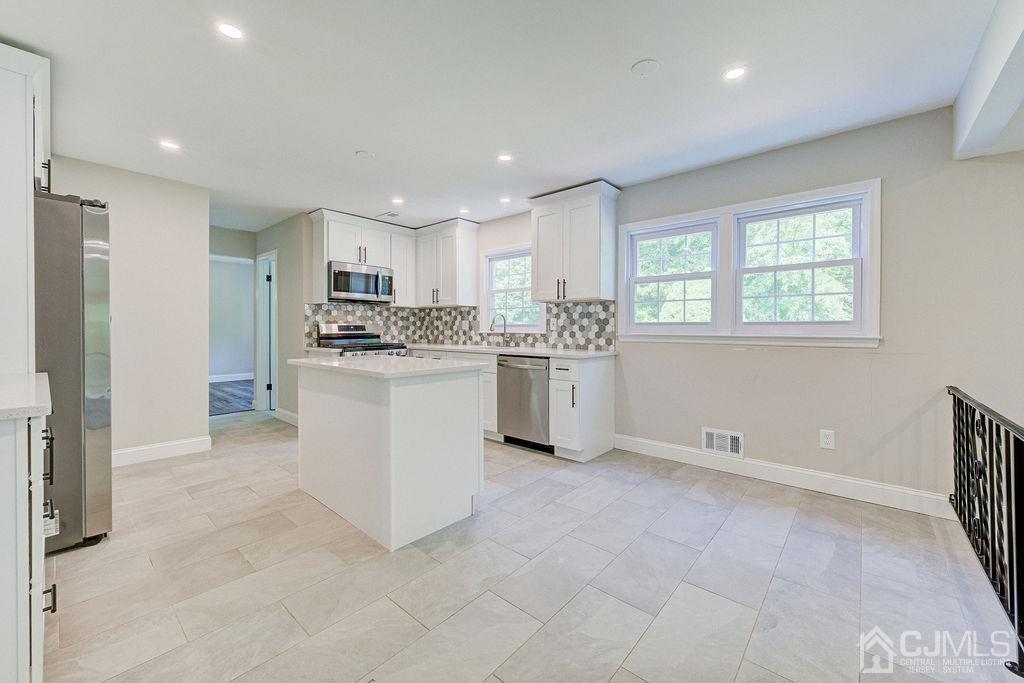 16 Oak Tree Road Monmouth Junction, NJ 08852 - Photo 3 of 29 a kitchen with white cabinets and white appliances