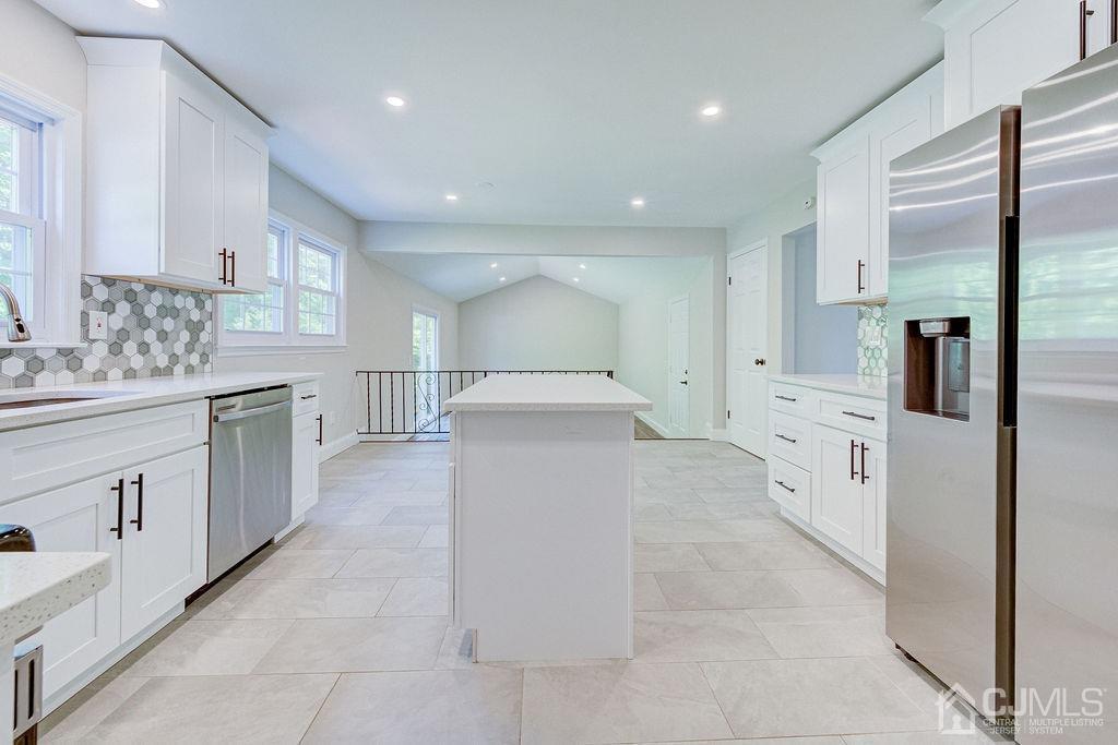 16 Oak Tree Road Monmouth Junction, NJ 08852 - Photo 4 of 29 a large white kitchen with stainless steel appliances