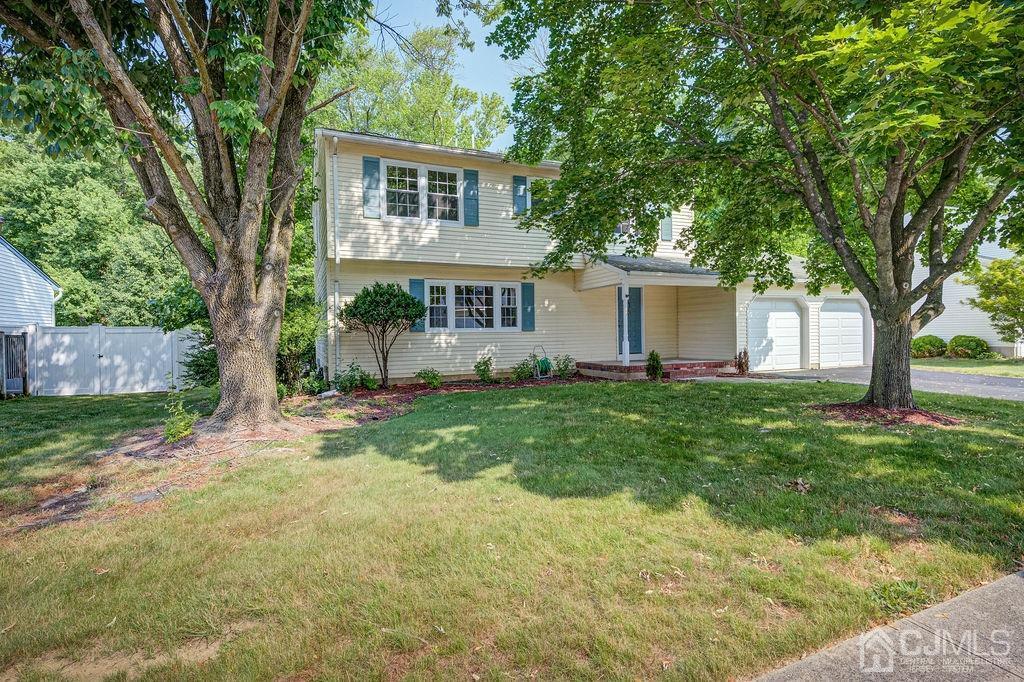 16 Oak Tree Road Monmouth Junction, NJ 08852 - Photo 5 of 29 a front view of house with yard and green space