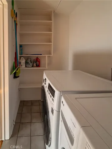 a view of a room with wooden floor and a window