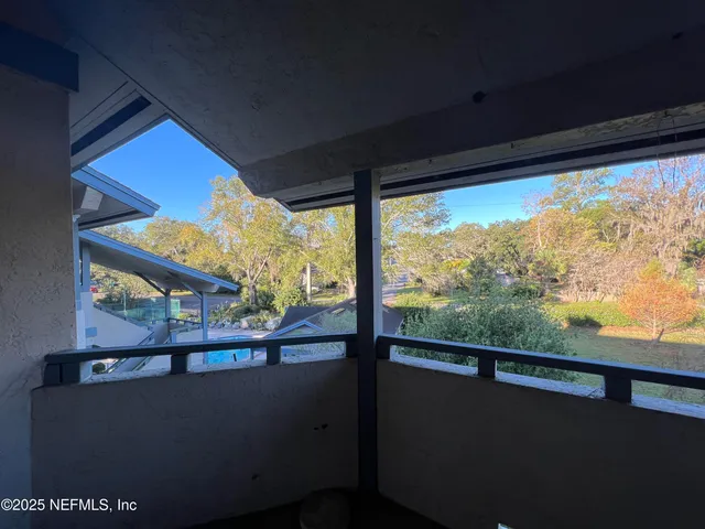 a view of balcony with furniture