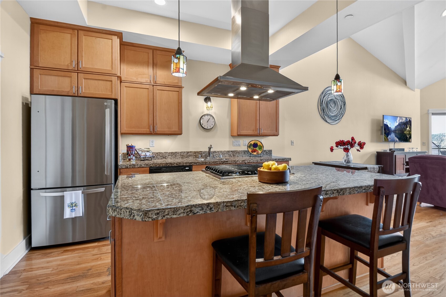 383 Romance Hill Road, Unit C Belfair, WA 98528 - Photo 4 of 25 a kitchen with a table and chairs in it
