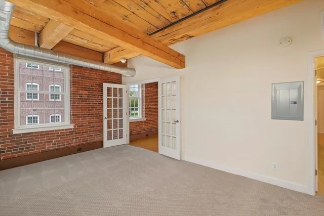 a bathroom with a granite countertop sink a mirror and a shower