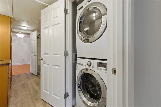 a view of a hallway with washer and dryer