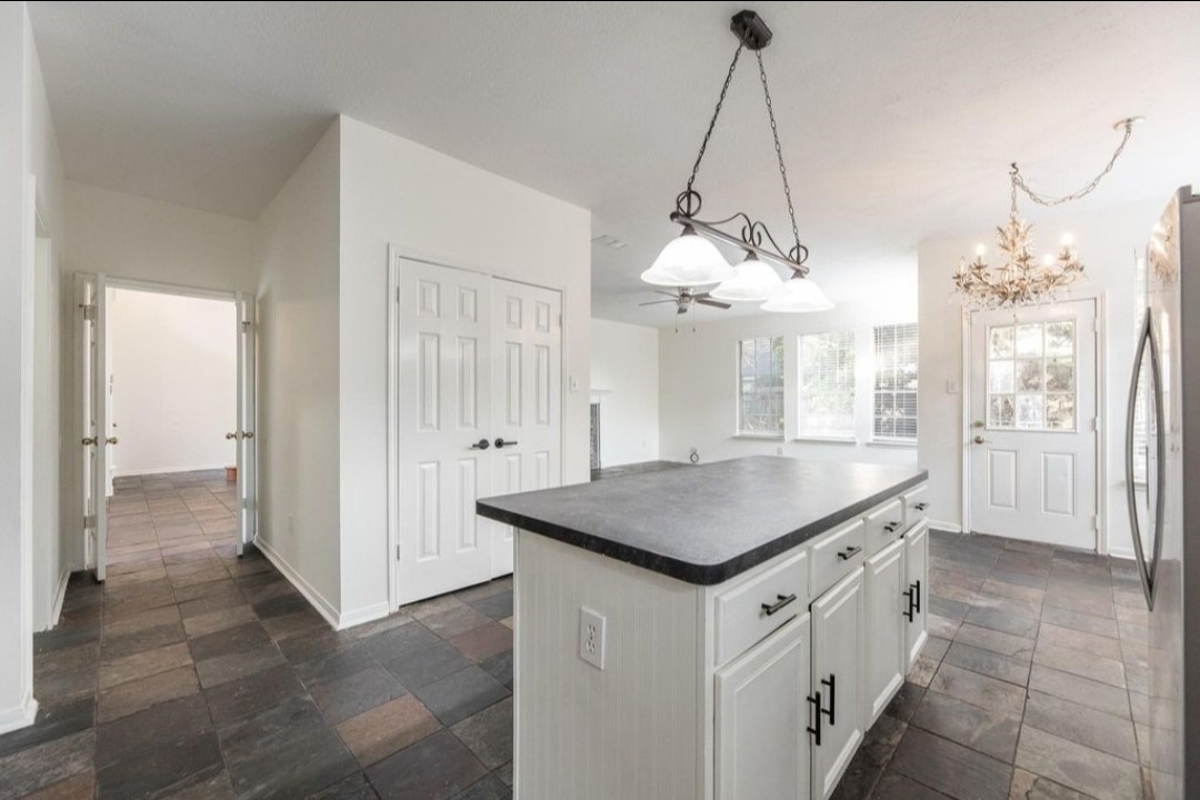2515 Falcon Ridge Street Pearland, TX 77584 - Photo 17 of 31 a kitchen that has a lot of cabinets in it