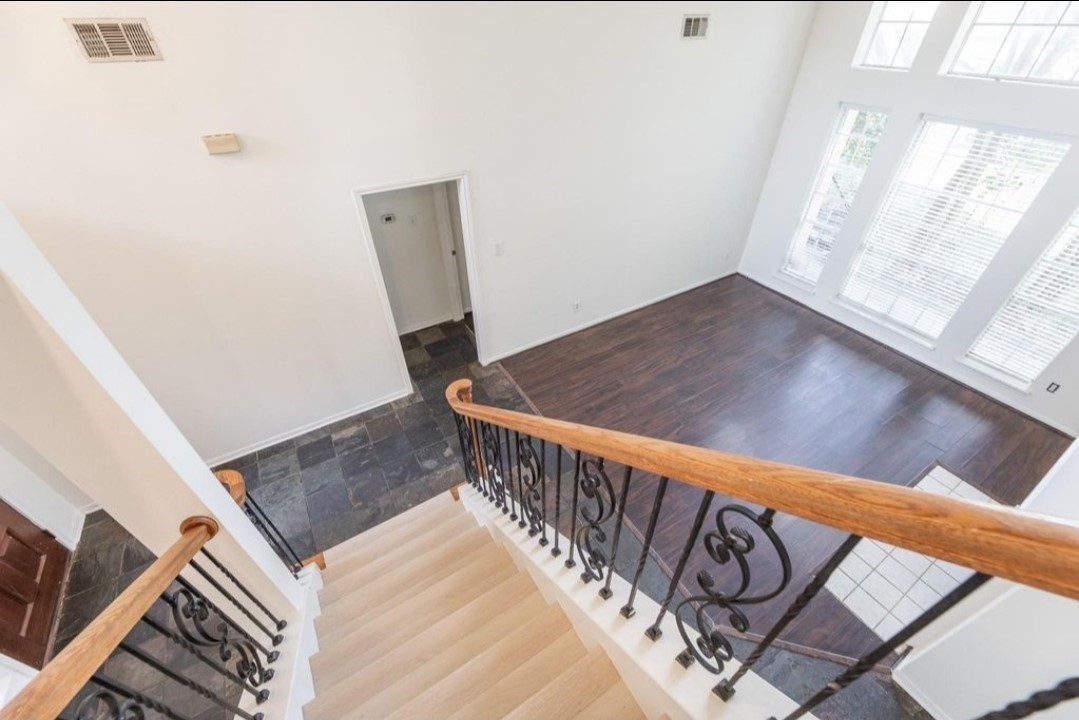 2515 Falcon Ridge Street Pearland, TX 77584 - Photo 24 of 31 a view of a hallway with wooden floor