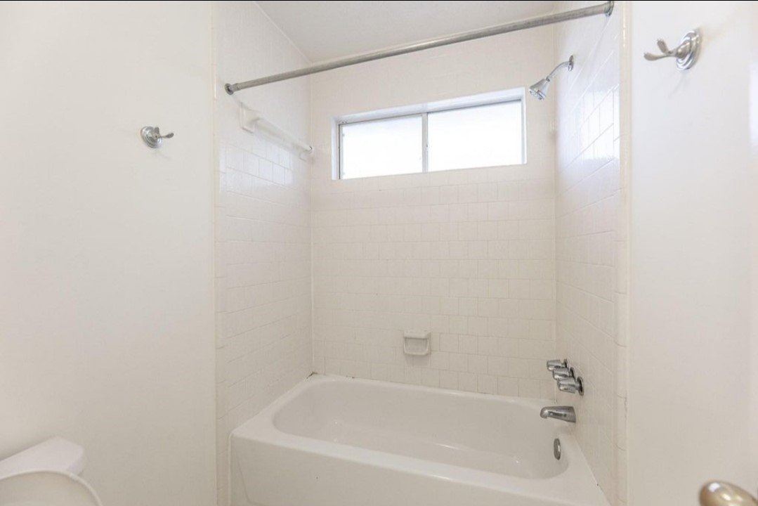2515 Falcon Ridge Street Pearland, TX 77584 - Photo 30 of 31 a close up of a bathtub curtain