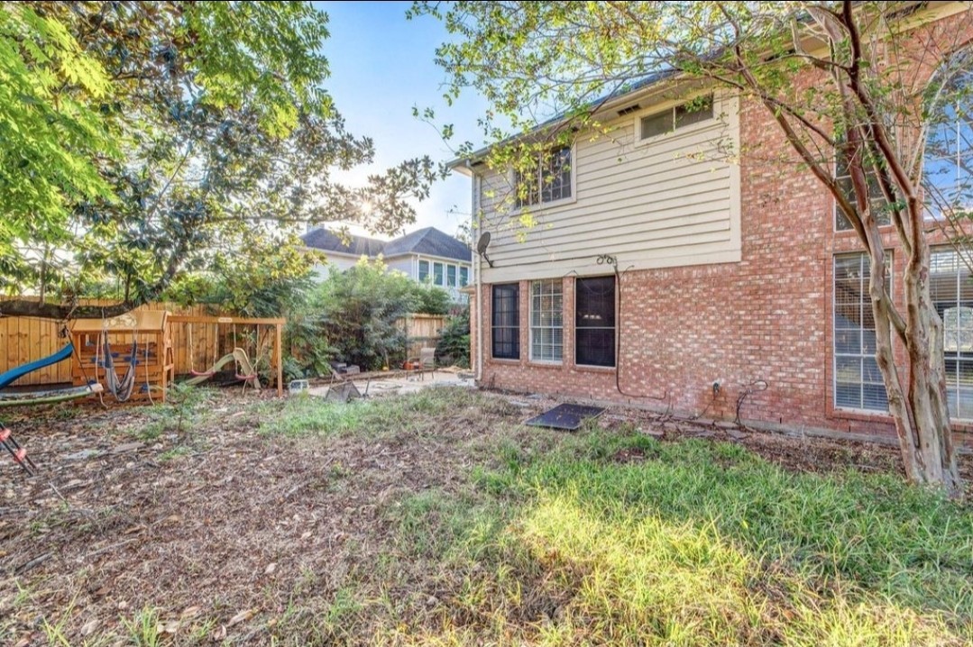 2515 Falcon Ridge Street Pearland, TX 77584 - Photo 31 of 31 a backyard of a house with seating space