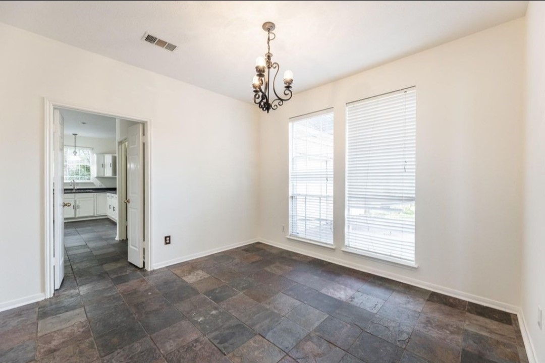 2515 Falcon Ridge Street Pearland, TX 77584 - Photo 7 of 31 a view of an empty room with a window