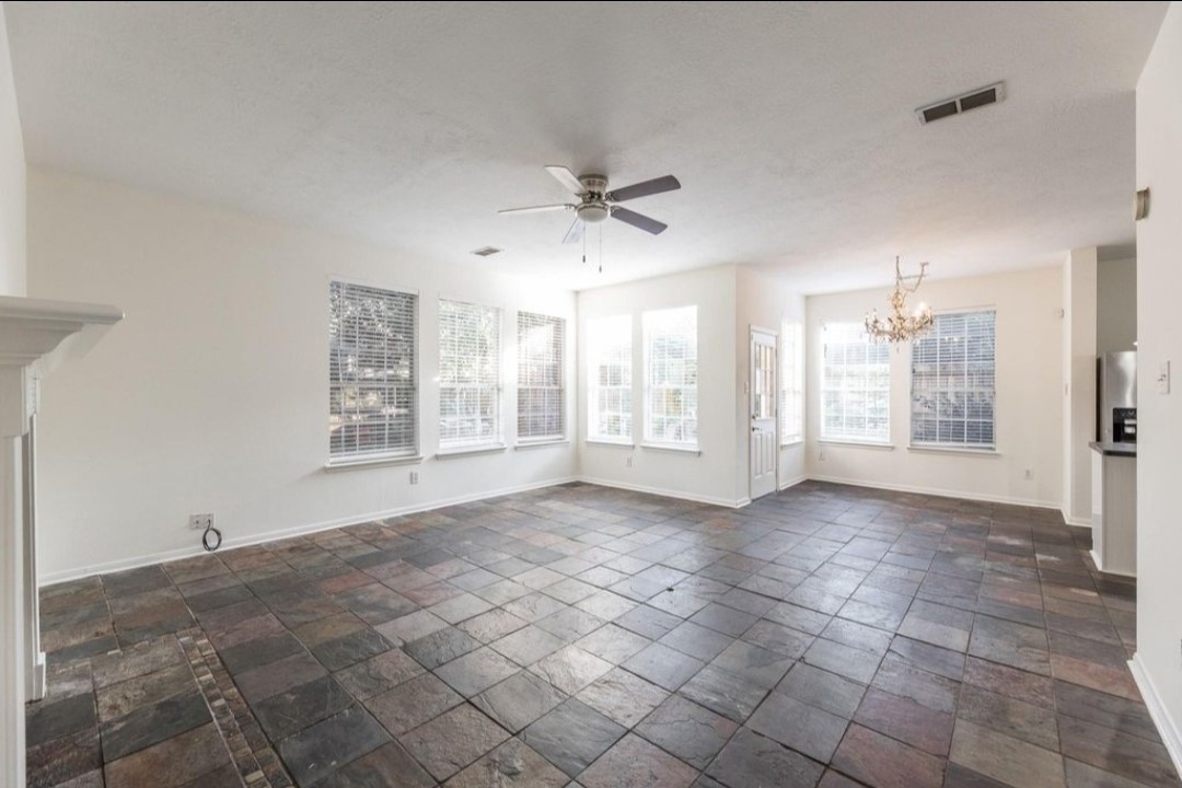 2515 Falcon Ridge Street Pearland, TX 77584 - Photo 10 of 31 a view of an empty room with a window