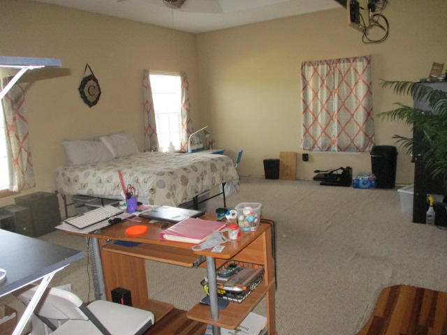 16728 78th Road North Loxahatchee, FL 33470 - Photo 12 of 23 a living room with furniture and a fireplace