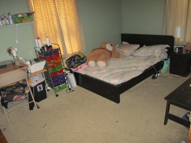 16728 78th Road North Loxahatchee, FL 33470 - Photo 16 of 23 a bed sitting in a bedroom next to a window