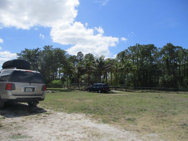 16728 78th Road North Loxahatchee, FL 33470 - Photo 18 of 23 a view of a car in front of a house