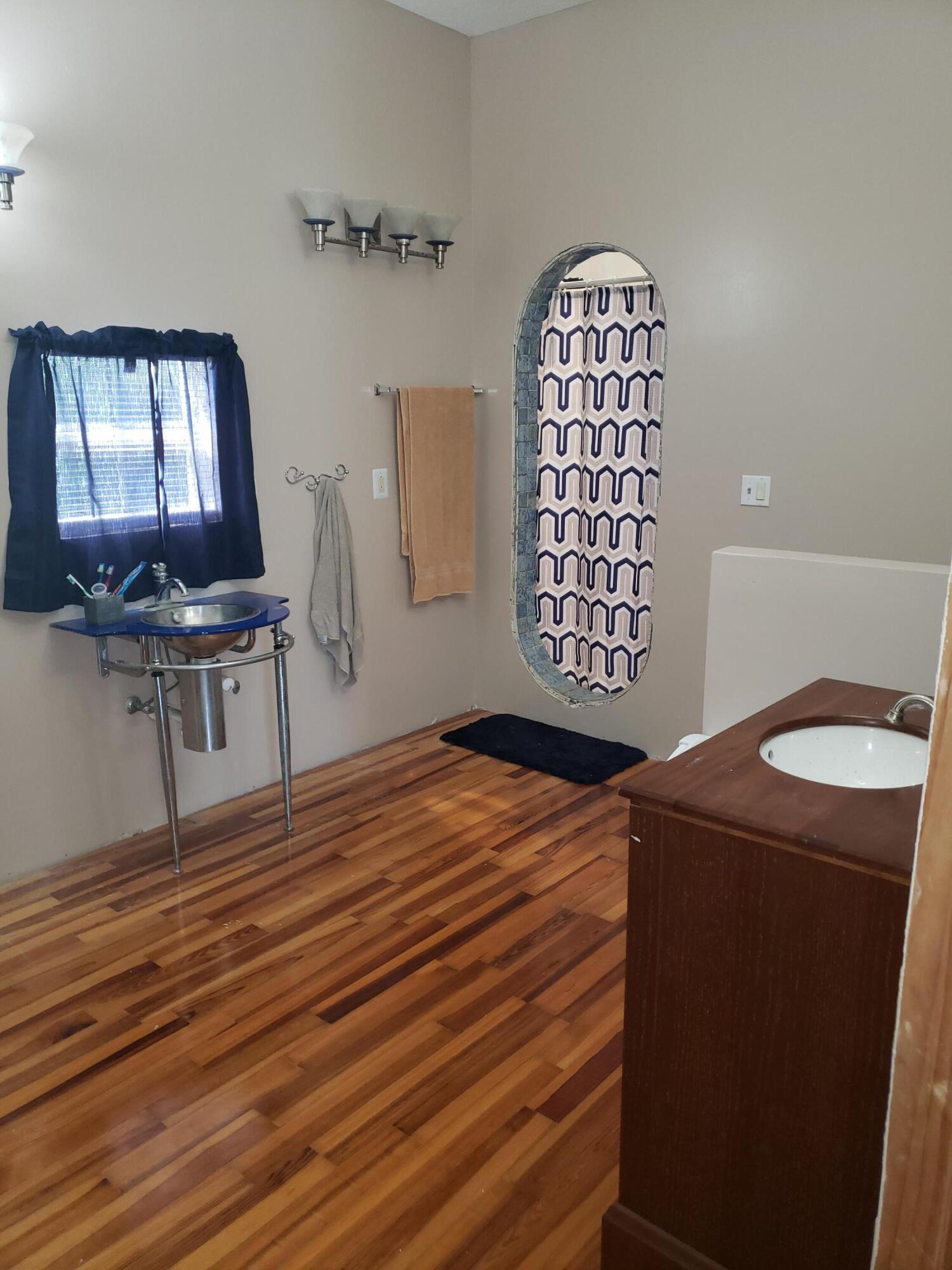 16728 78th Road North Loxahatchee, FL 33470 - Photo 20 of 23 a bedroom with a bed and a chair