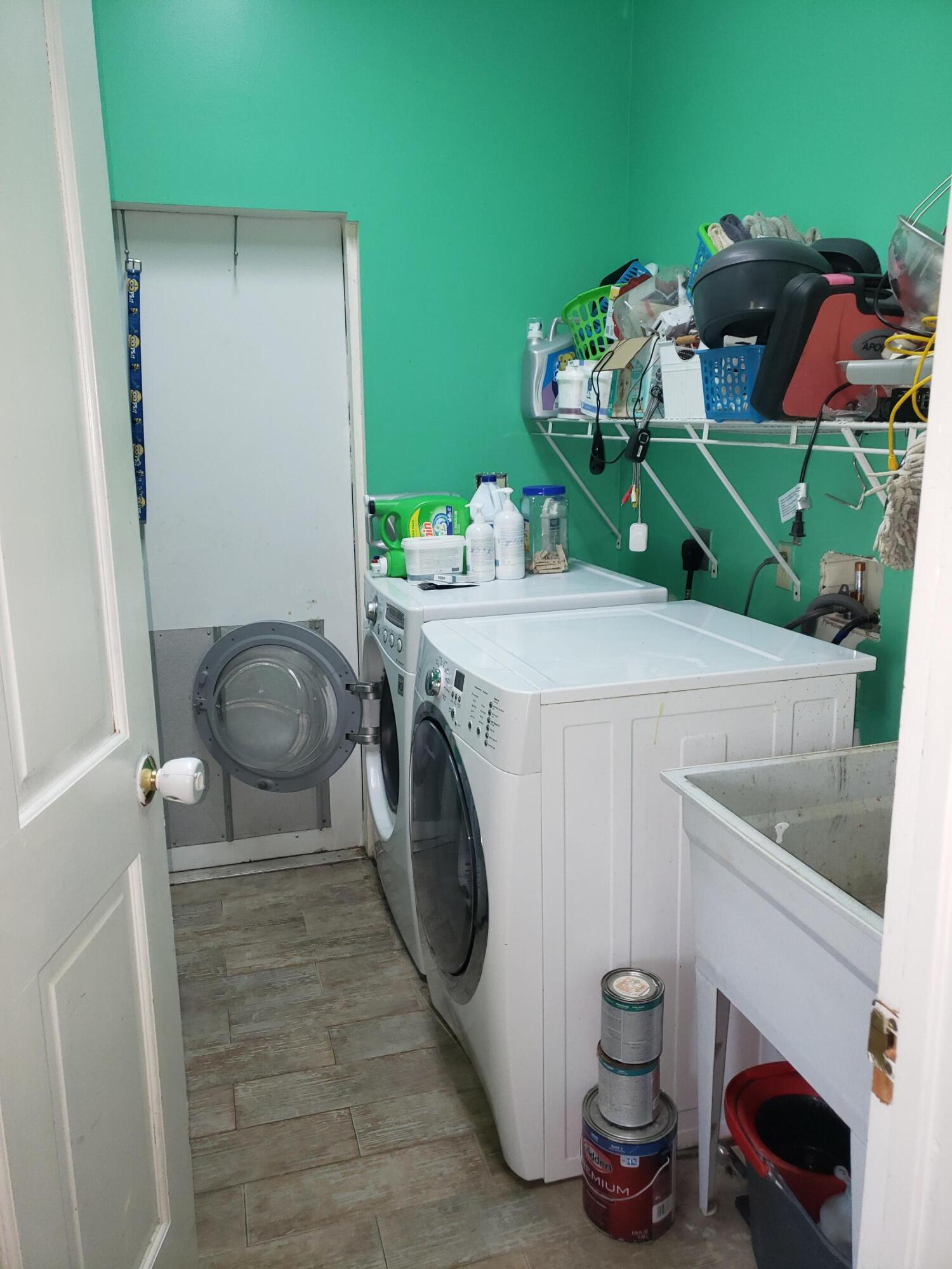 16728 78th Road North Loxahatchee, FL 33470 - Photo 23 of 23 a utility room with dryer and washer
