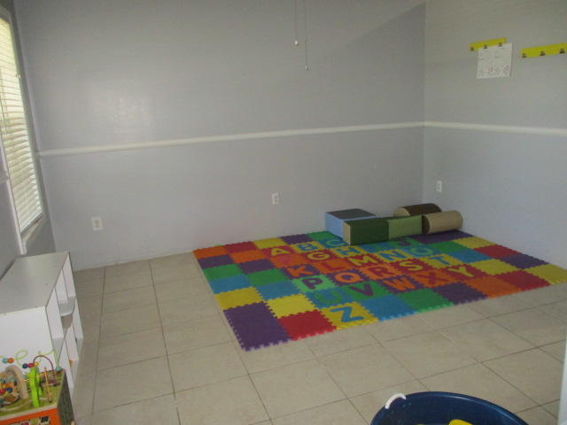 16728 78th Road North Loxahatchee, FL 33470 - Photo 5 of 23 a bedroom with a bed and a window