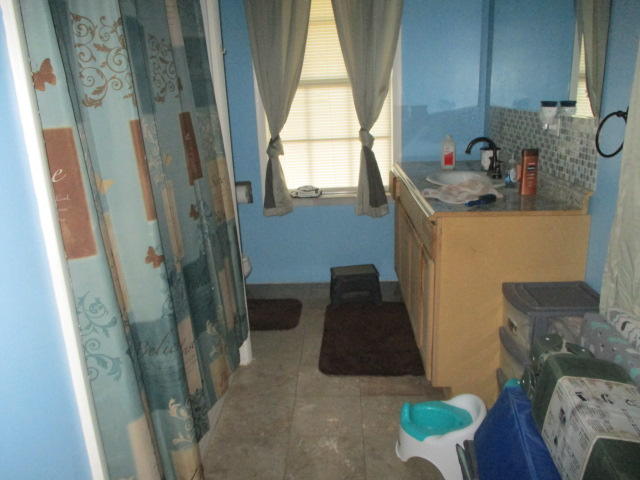 16728 78th Road North Loxahatchee, FL 33470 - Photo 10 of 23 a bathroom with a sink and a window